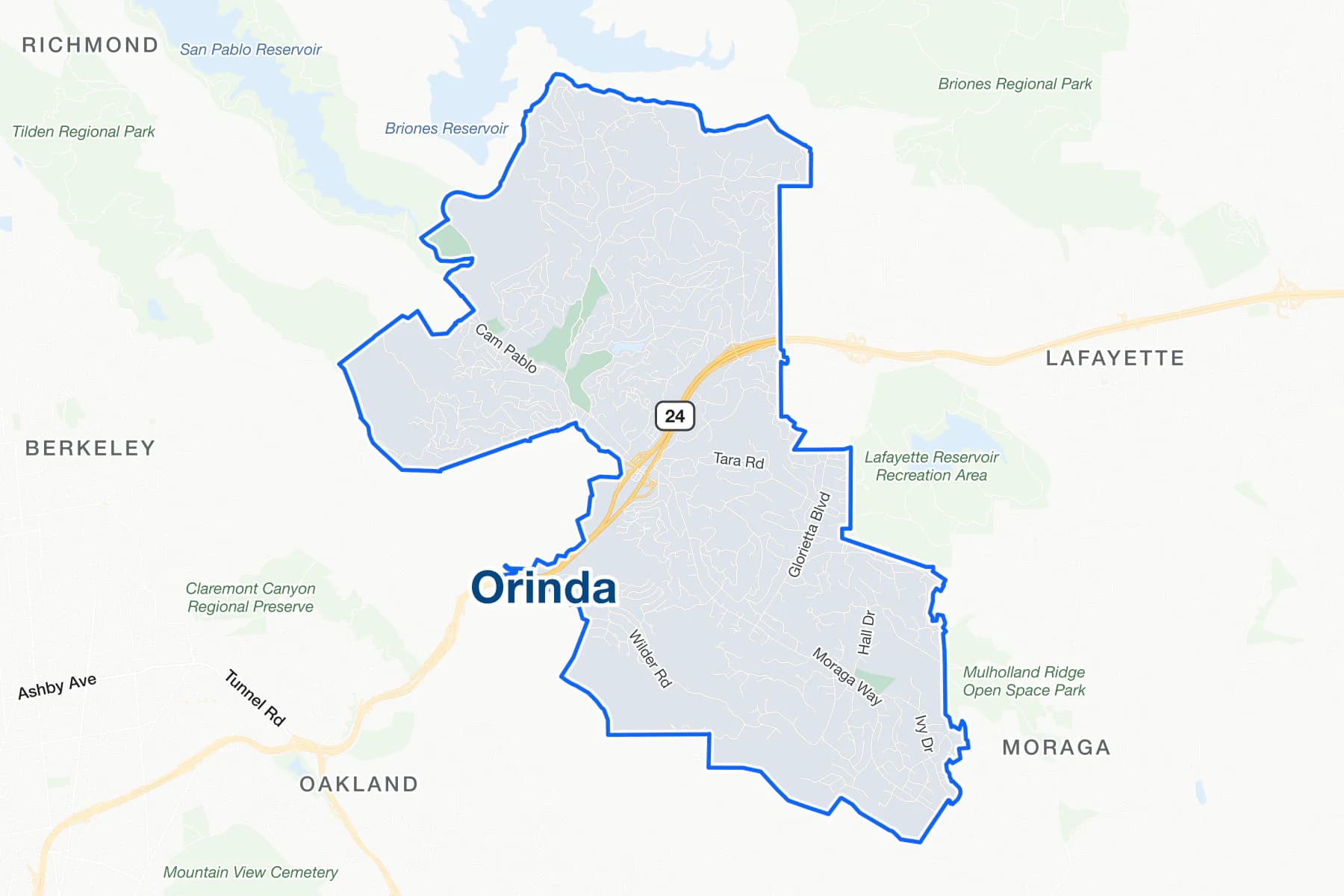 Street map of Orinda with State Route 24 through the middle, Camino Pablo, Moraga Way and Wilder Road labelled, and San Pablo and Briones reservoirs to the north.